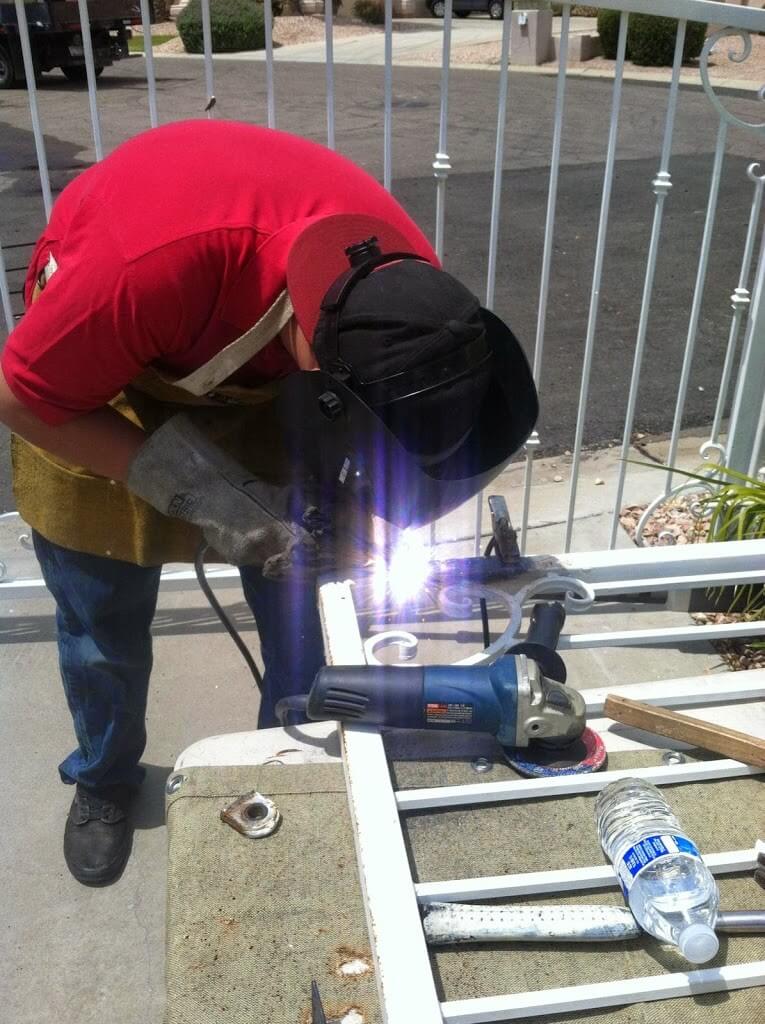 Performing mobile welding on a property gate.