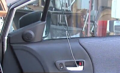 Unlocking a car door with over under tool. Unlocking car door