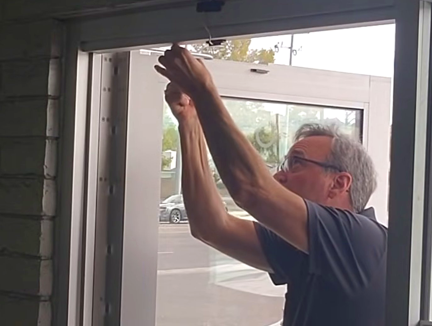 Owner, Robert, adjusting a door closer