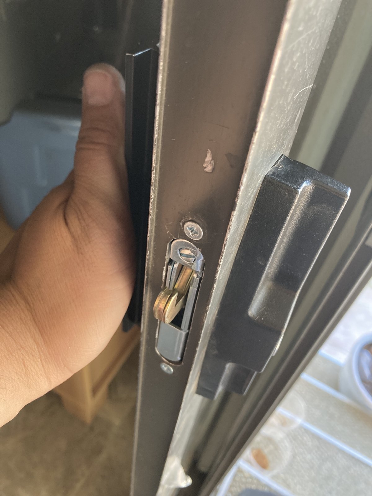 Keyed lock and latch on a sliding glass door, Mesa